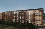 Moderne Wohnanlage mit Holz- und Putzfassade_2